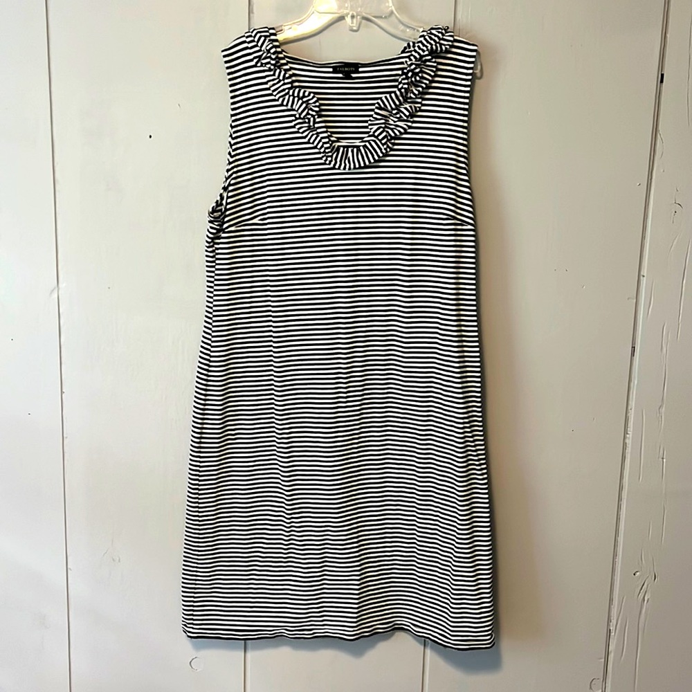 Sleeveless summer dress with ruffle neckline. Excellent condition.